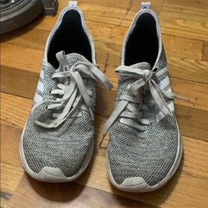 gray and white adidas sneakers